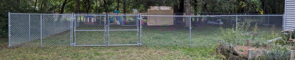 A backyard with a chain link fence in Waterloo, Iowa.