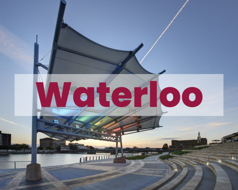 The word "Waterloo" is written on the side of a chain link fence.